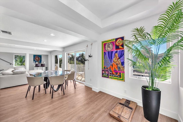 dining area with light hardwood / wood-style floors