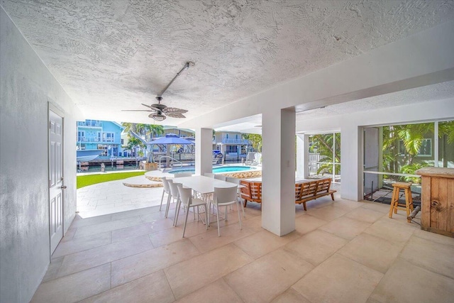 view of patio / terrace with an outdoor living space and ceiling fan