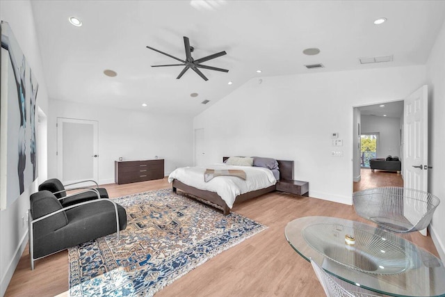 bedroom with lofted ceiling, light hardwood / wood-style flooring, and ceiling fan