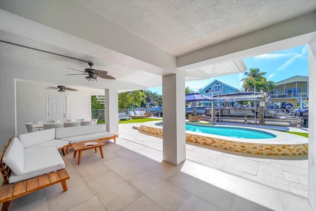 view of patio / terrace with an outdoor hangout area and ceiling fan