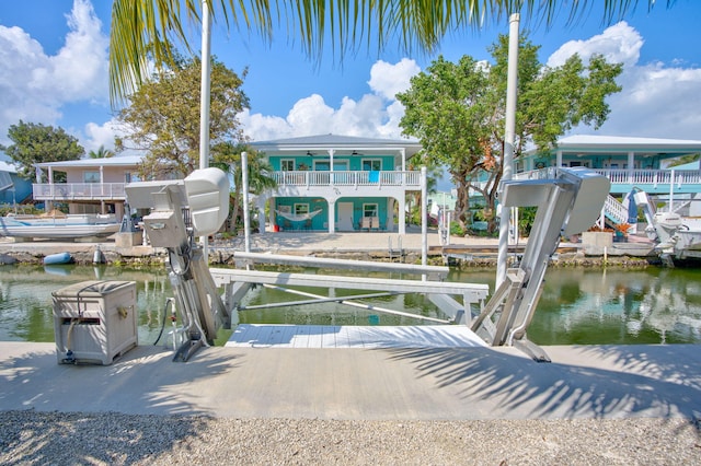 view of dock featuring a water view and boat lift