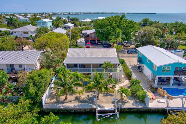 bird's eye view with a water view and a residential view