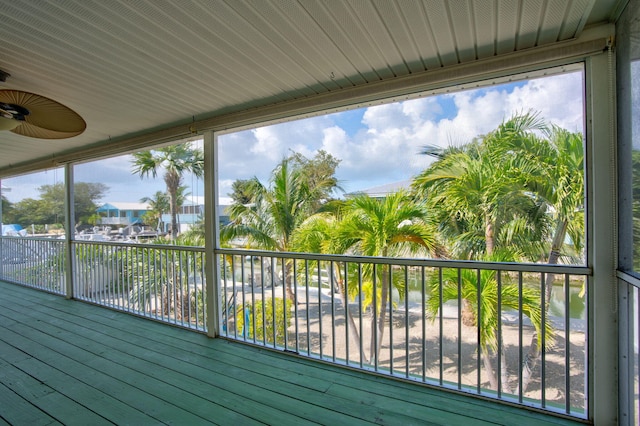 wooden terrace featuring ceiling fan