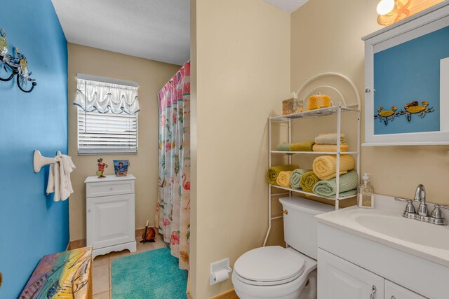 full bath with toilet, vanity, a shower with shower curtain, and tile patterned floors