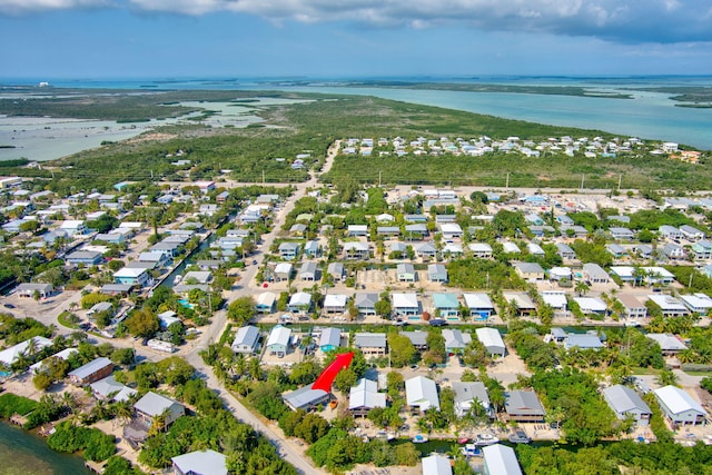 birds eye view of property featuring a residential view and a water view