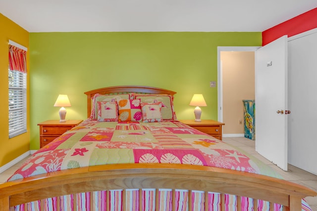 tiled bedroom with baseboards