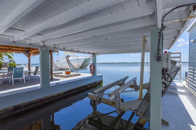 view of dock with a water view and boat lift