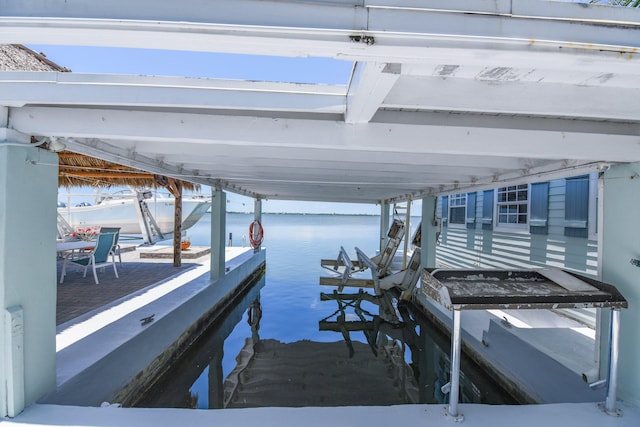 dock area featuring a water view and boat lift