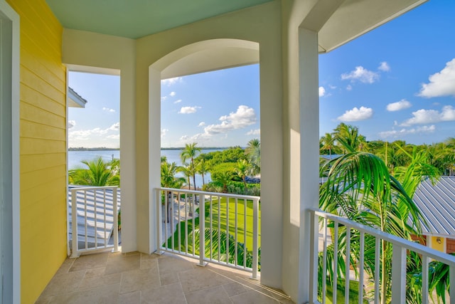 balcony featuring a water view