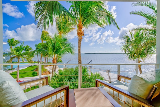 balcony featuring a water view