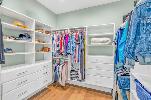 spacious closet featuring light hardwood / wood-style floors