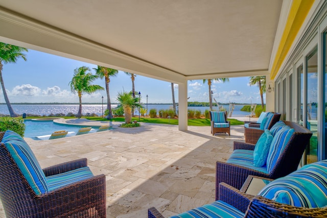 view of patio featuring a water view, an outdoor hangout area, and a pool with hot tub