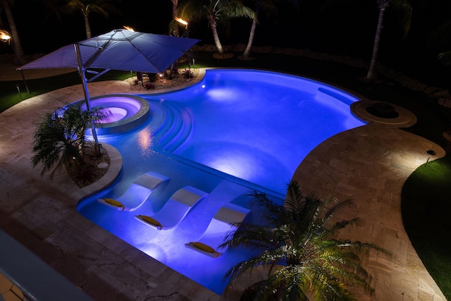 view of pool featuring an in ground hot tub