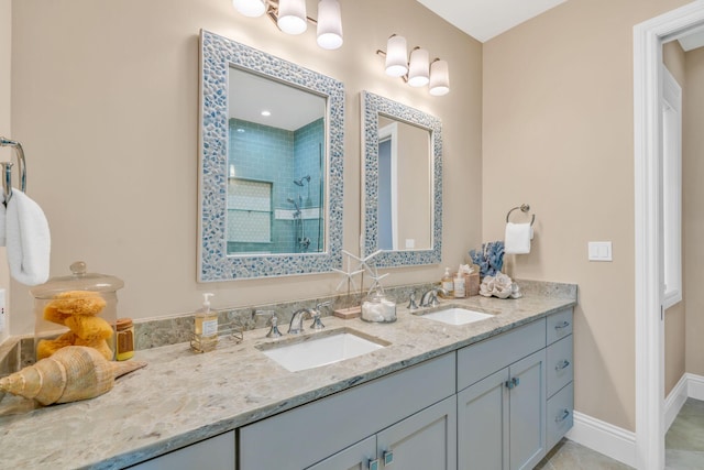 bathroom with vanity, tile patterned flooring, and walk in shower