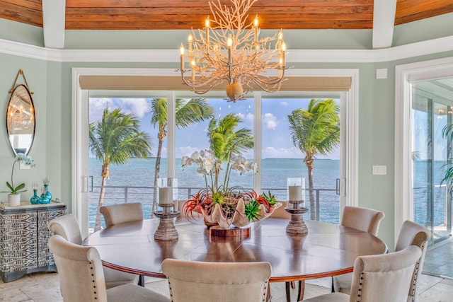 dining room featuring a water view, a notable chandelier, and beam ceiling