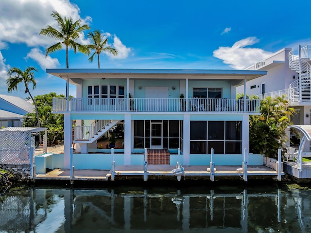 115 Primrose Ln, Long Key, FL 33001 - rear view of property with a water view, stairway, and stucco siding