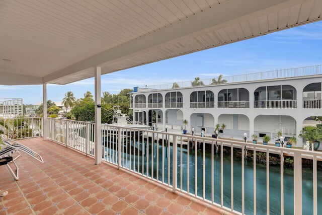 balcony featuring a water view