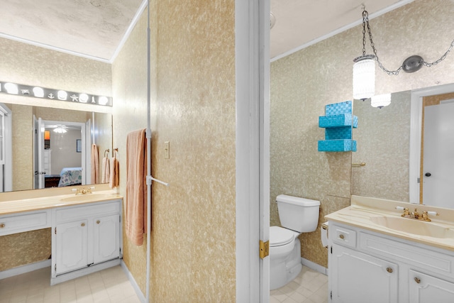 bathroom featuring crown molding, tile patterned floors, vanity, and toilet