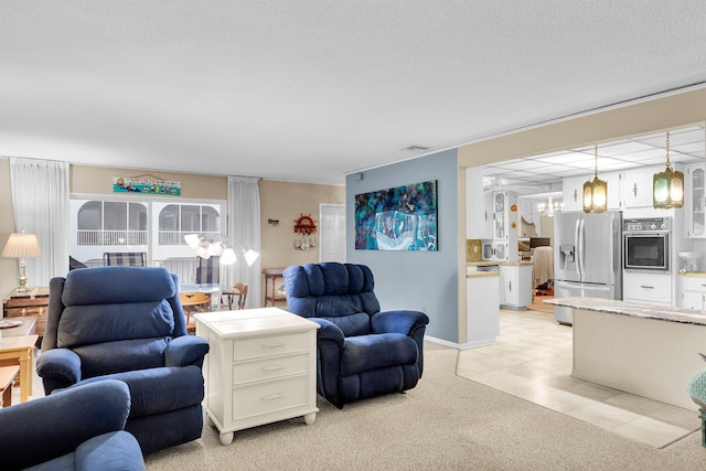 living room with light colored carpet and a textured ceiling