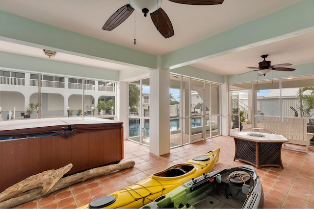 sunroom / solarium with ceiling fan