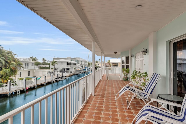 balcony featuring a water view