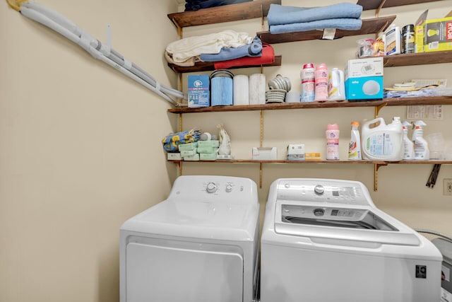 washroom featuring washer and dryer