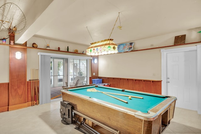 recreation room with light tile patterned floors, wooden walls, and billiards