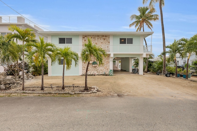 115 Primrose Ln, Long Key, FL 33001 - coastal inspired home featuring a carport, driveway, and stone siding