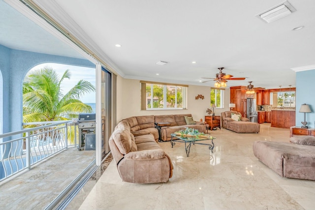 living room featuring crown molding