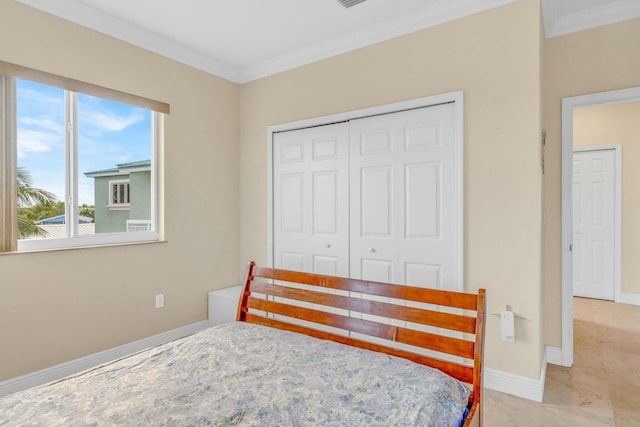 bedroom with crown molding and a closet