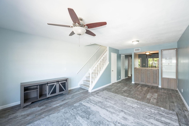 3314 Northside Dr Unit 145, Key West, FL 33040 - unfurnished living room with wood finished floors, stairs, and a ceiling fan