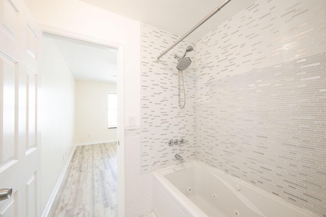 3314 Northside Dr Unit 145, Key West, FL 33040 - full bath featuring a combined bath / shower with jetted tub and wood finished floors