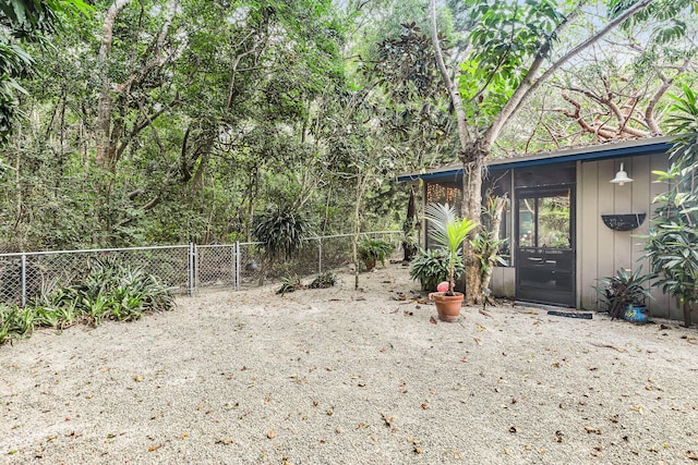 view of yard with a sunroom