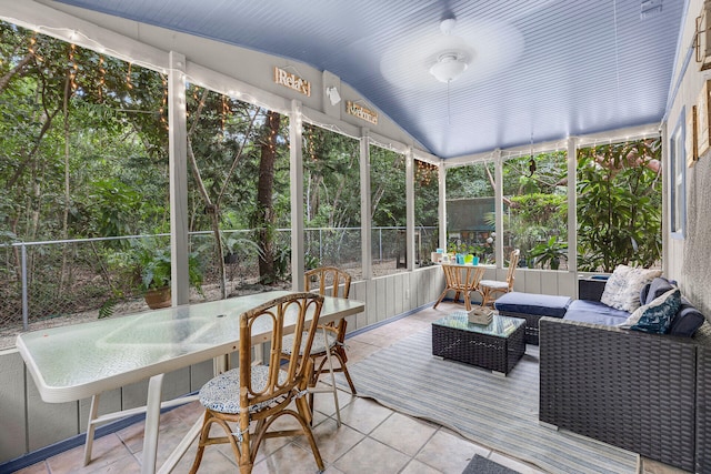 sunroom / solarium with vaulted ceiling