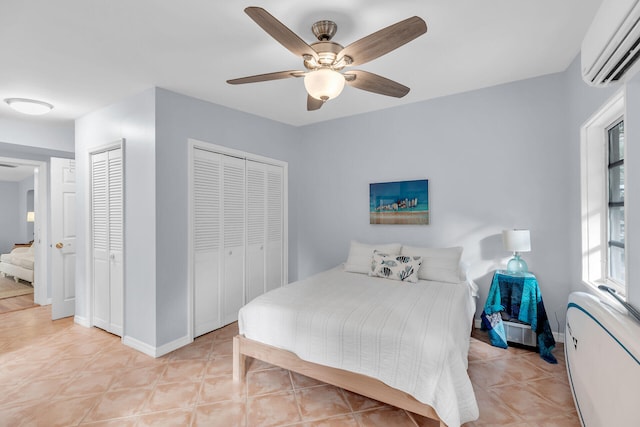 tiled bedroom featuring ceiling fan and a wall unit AC