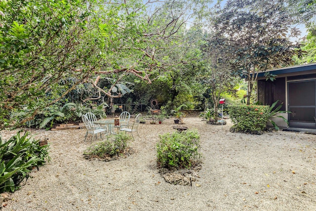 view of yard with a sunroom