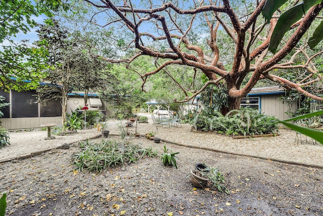 view of yard with a sunroom