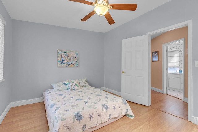 bedroom with light hardwood / wood-style flooring and ceiling fan