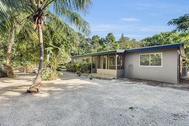 view of front of property with a sunroom