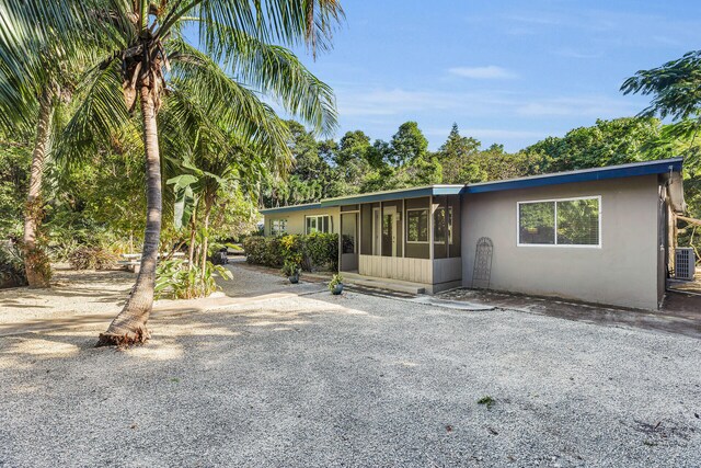 view of front of home with a sunroom