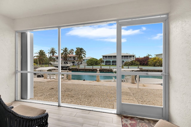 389 N Anglers Dr Unit 105, Marathon, FL 33050 - unfurnished sunroom featuring healthy amount of natural light and a water view