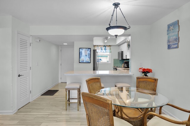 389 N Anglers Dr Unit 105, Marathon, FL 33050 - dining area featuring light wood-type flooring and recessed lighting