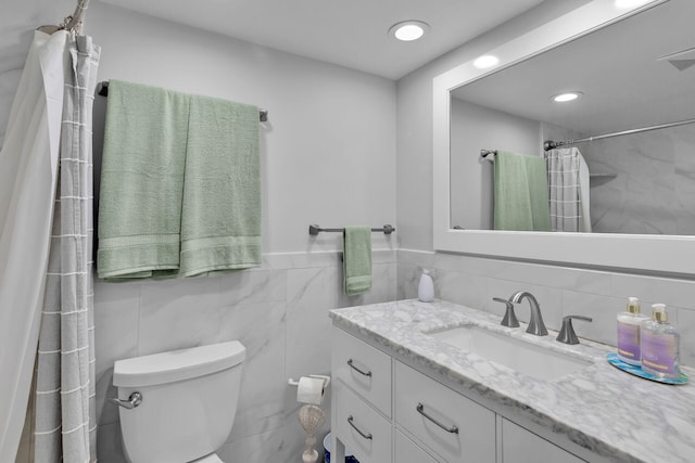 389 N Anglers Dr Unit 105, Marathon, FL 33050 - bathroom with tile walls, vanity, a shower with curtain, and recessed lighting
