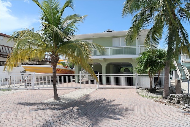 view of front of house with a balcony