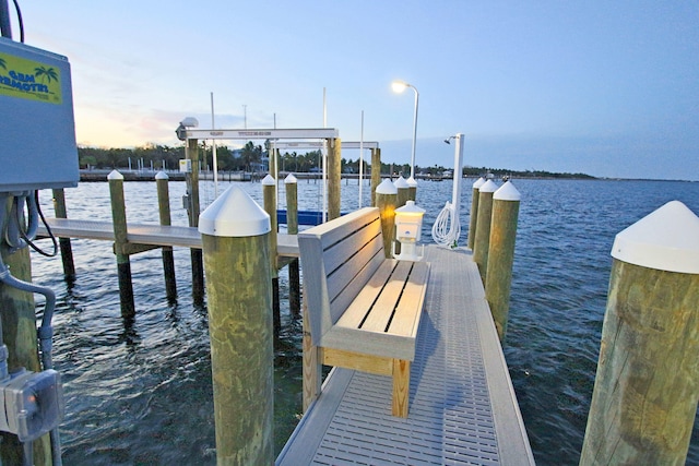 view of dock with a water view