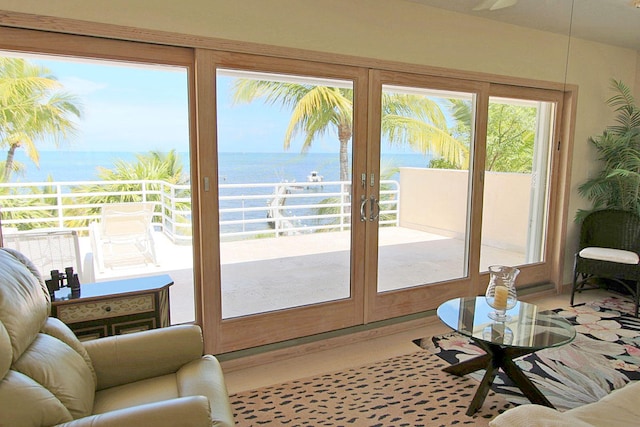 doorway with french doors and a water view