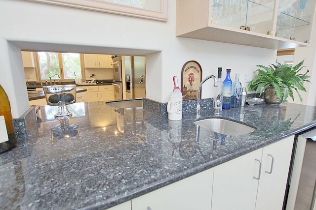 88547 Old Hwy, Tavernier, FL 33070 - kitchen featuring a sink, dark stone countertops, and double oven