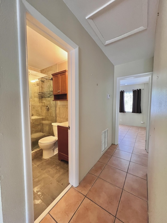 hall featuring light tile patterned flooring