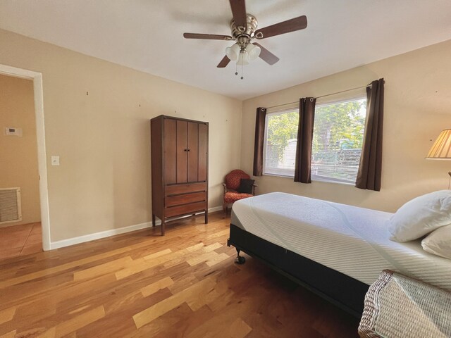 bedroom featuring ceiling fan and light wood-type flooring