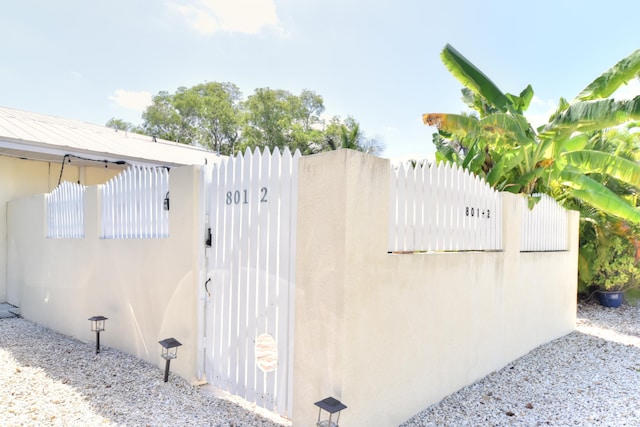 view of gate featuring fence